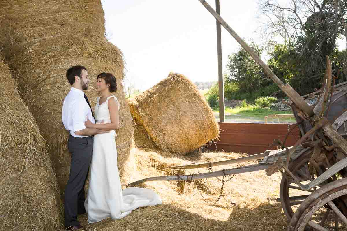 Photography session by a barn with hay