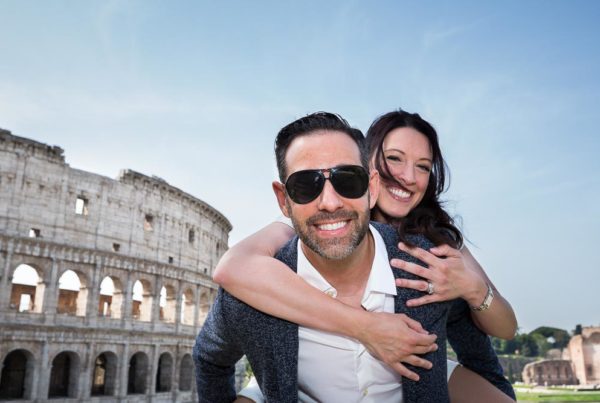 Couple fun and lively portrait in Rome Italy at the Roman Colosseum