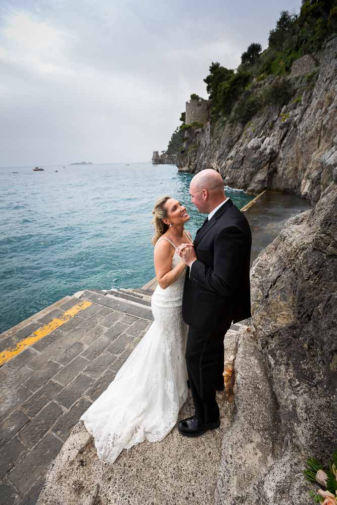 Bride and groom together by the Mediterranean sea