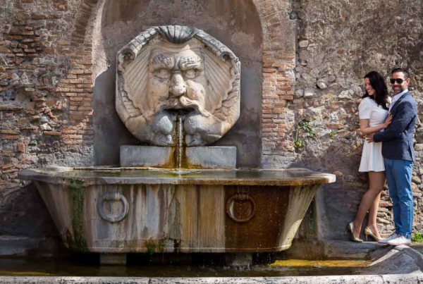 Couple portrait at the water fountain of Giardino degli Aranci. Engagement like session