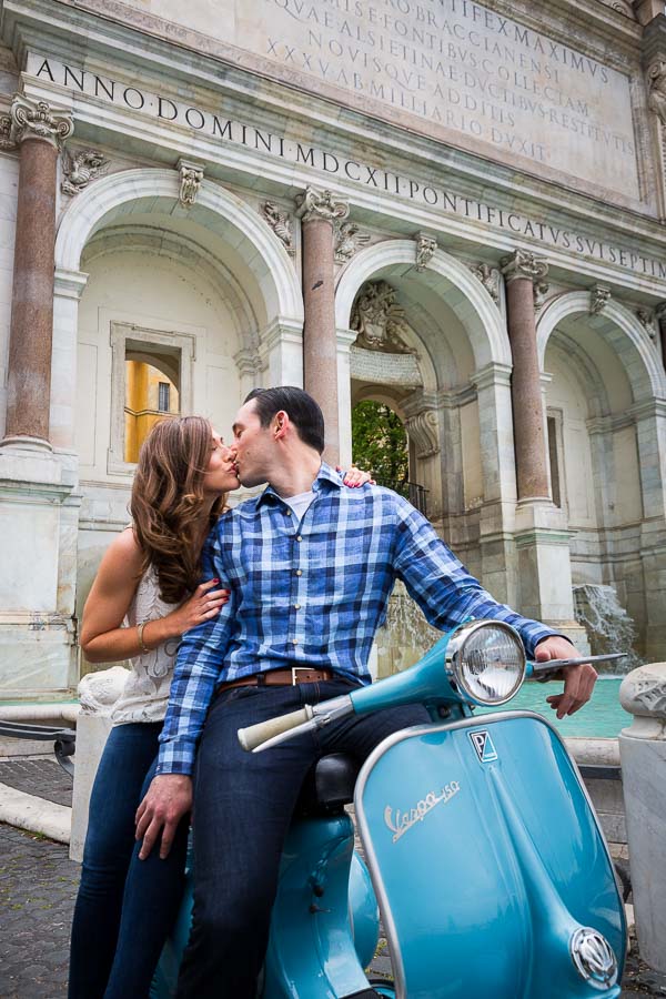 In love. Kissing by the Fontanone water fountain on a vespa.