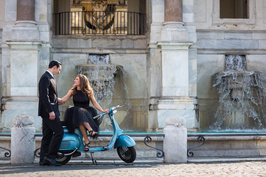 Coupe engagement photography sitting on a vespa during a photo shoot in Rome Italy