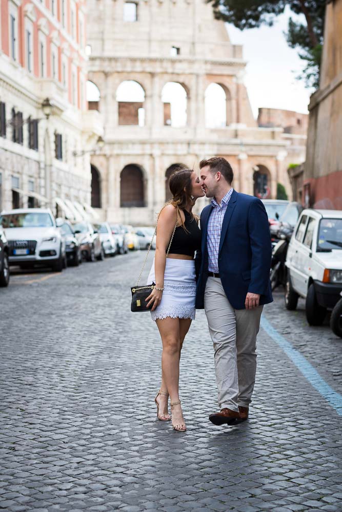 Walking in love in Rome. Romantic image of a couple walking while kissing