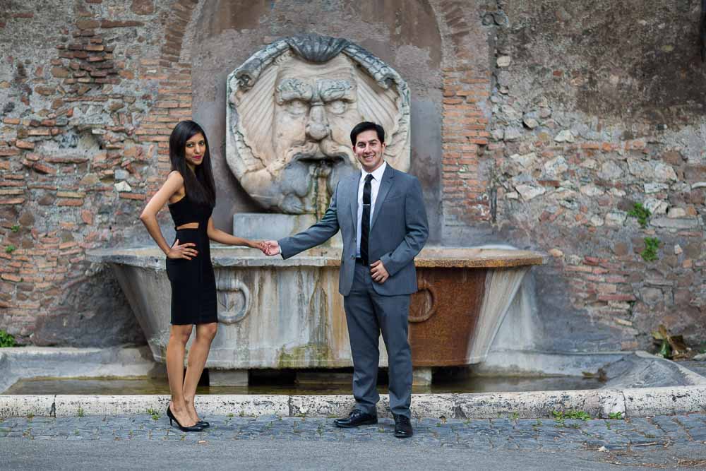 Water fountain engaged couple portrait