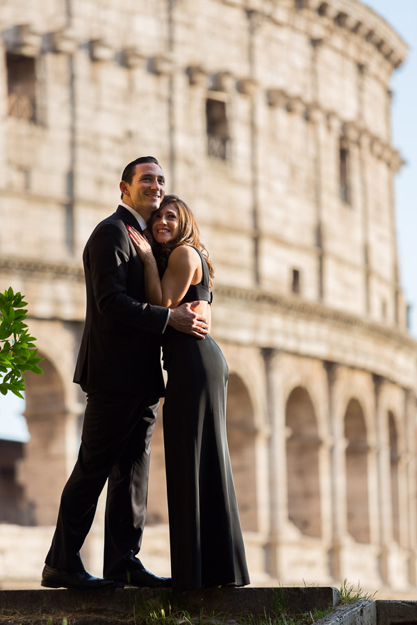 Portrait picture of a couple in formal attire at the Roman Colosseum