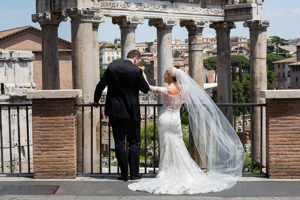 Newlyweds looking at the roman forum