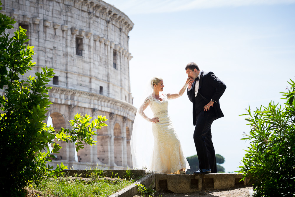 Gallantry gesture at the Roman Colosseum during a wedding photography session