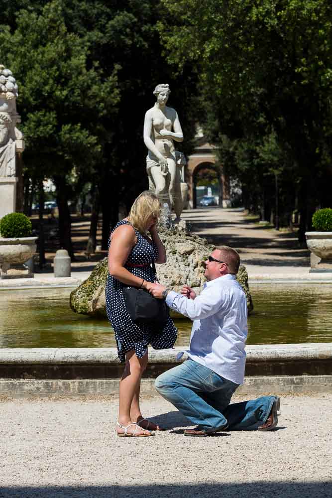 Man knee down Rome Marriage Proposal at the gardens of Villa Borghese