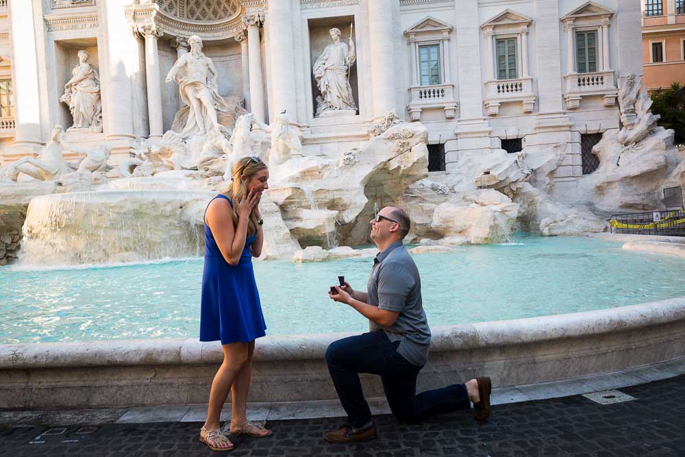 Wedding marriage proposal taking place at the Trevi fountain in Rome Italy