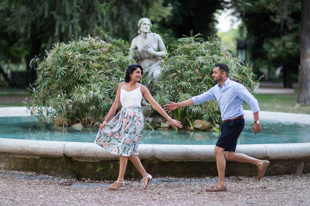 Chasing after you by a water fountain