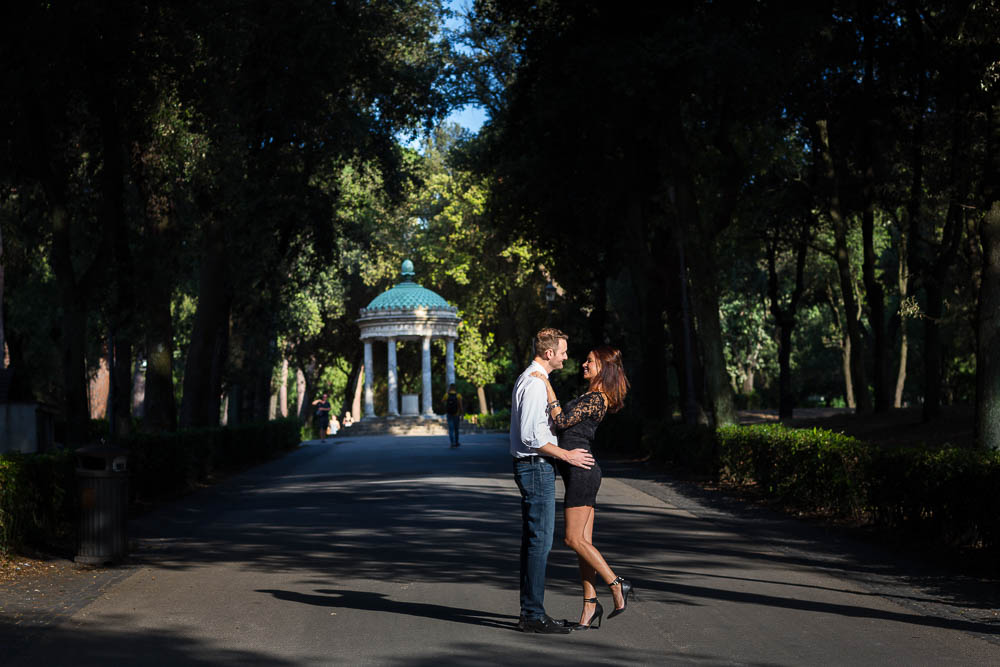 Couple posing in front of temple of Diana in Rome Italy