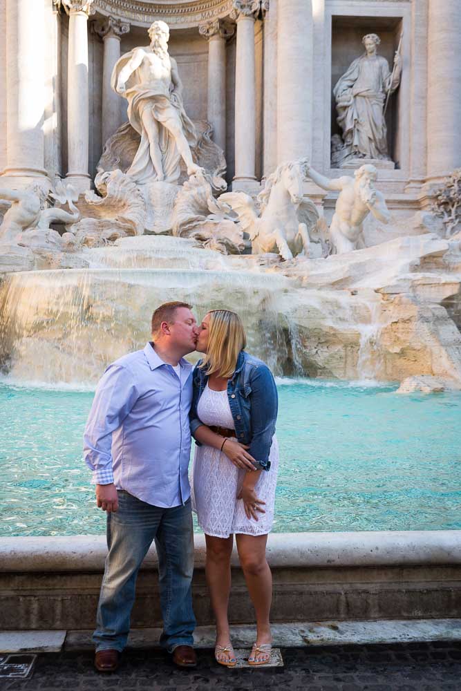 Engaged in Rome. Kissing at the Trevi fountain