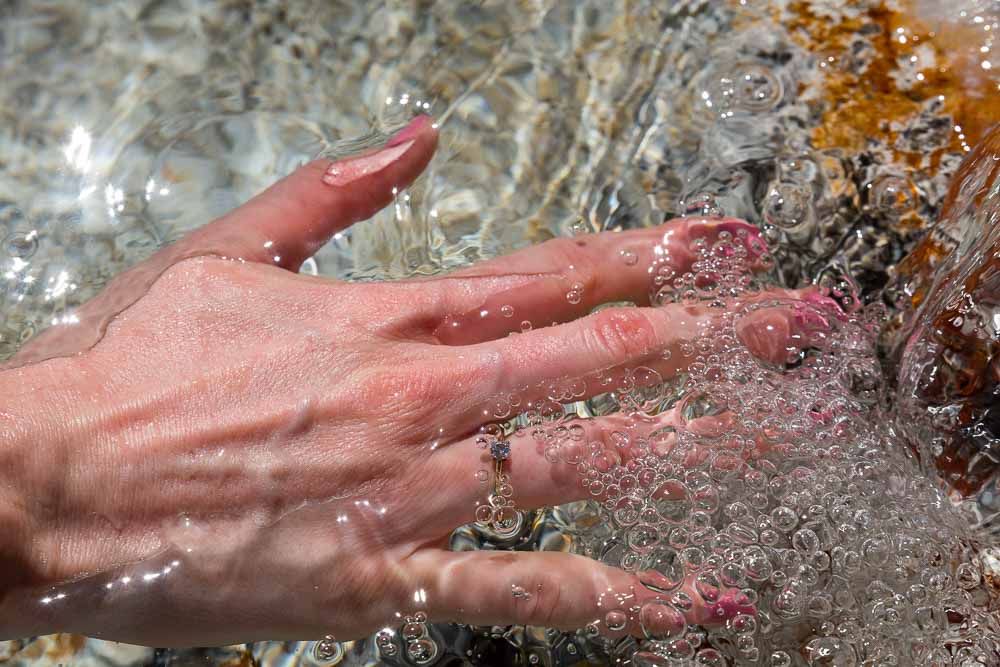 The engagement ring pictures while immersed in clear white water