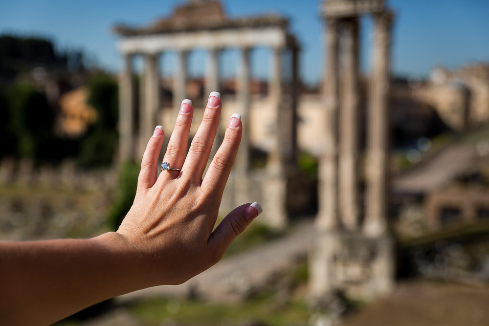 Engagement ring picture over ancient temple columns found in the Roman Forum