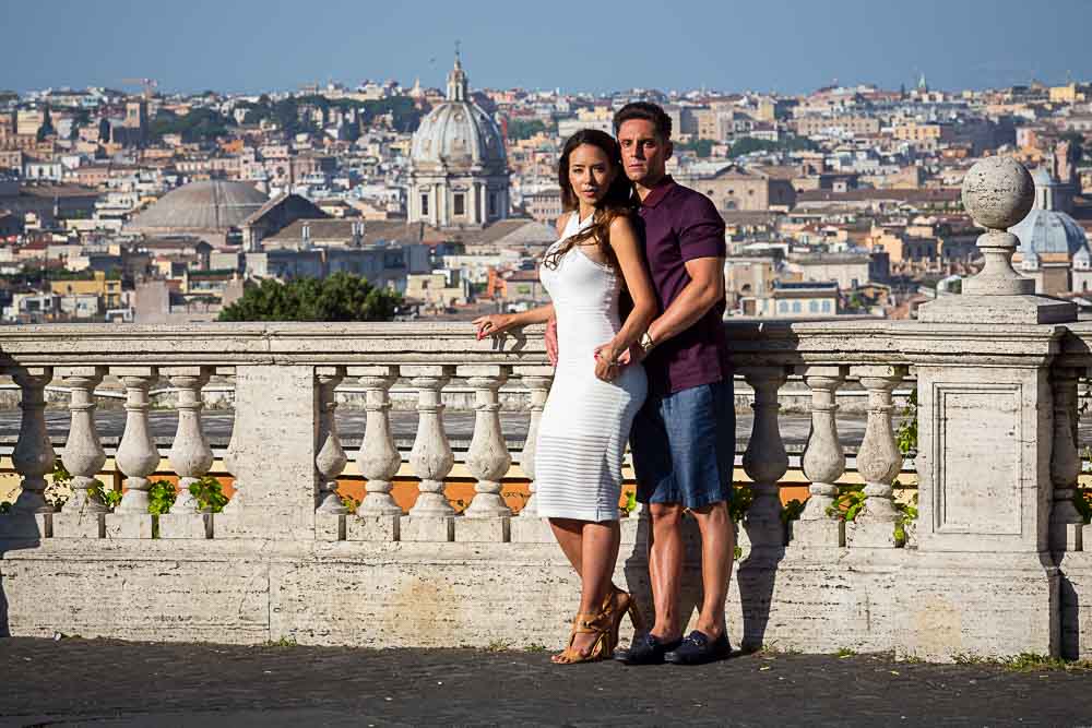 Couple posing for engagement pictures in Rome by the Janiculum hill