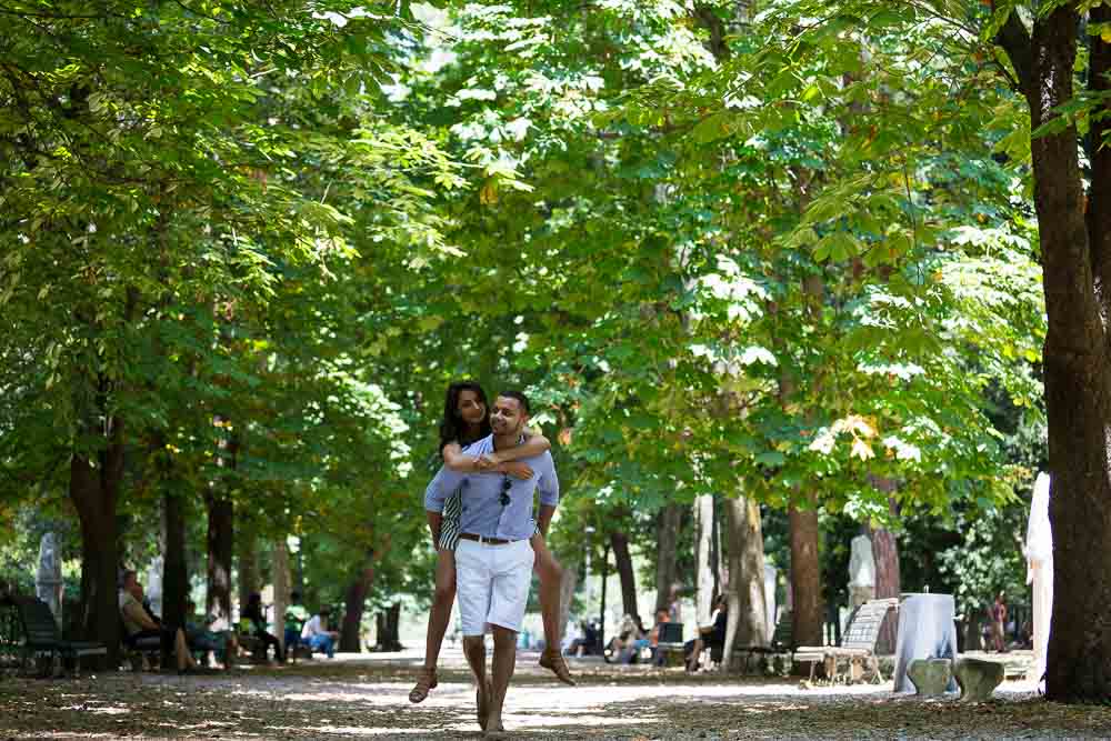 Fun piggy ride under Italian green trees