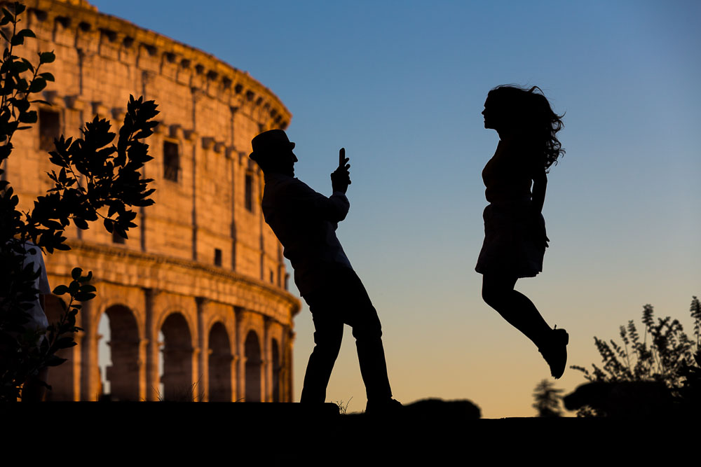 Jumping up in the air during an engagement photo session in Rome Italy