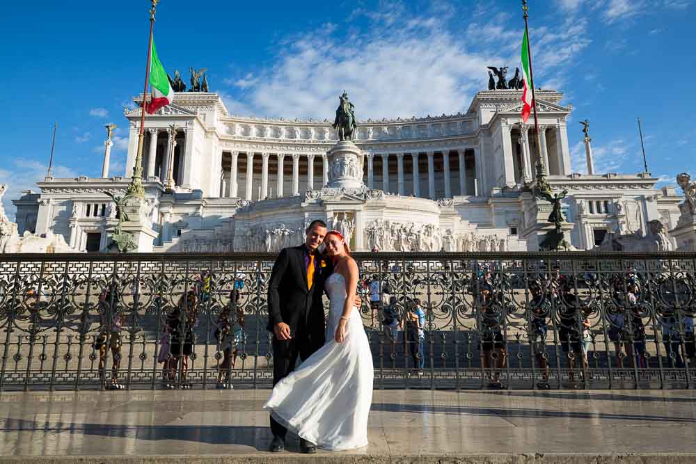 Portrait image of bride and groom at the Vittoriano monument