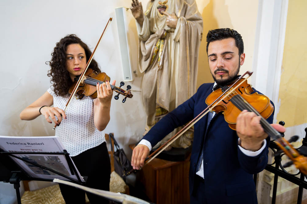 Matrimonial music being played. Violins