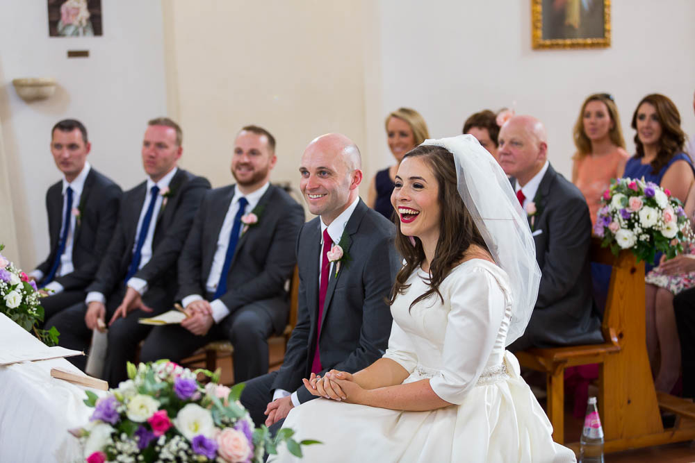 Smiling during the wedding ceremony