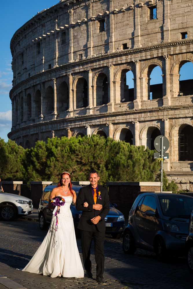 Walking after marriage in the roman alleyways in around the coliseum stepping on cobble stone streets