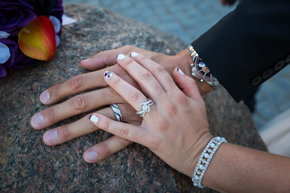 Wedding rings photographed on dark marble stone