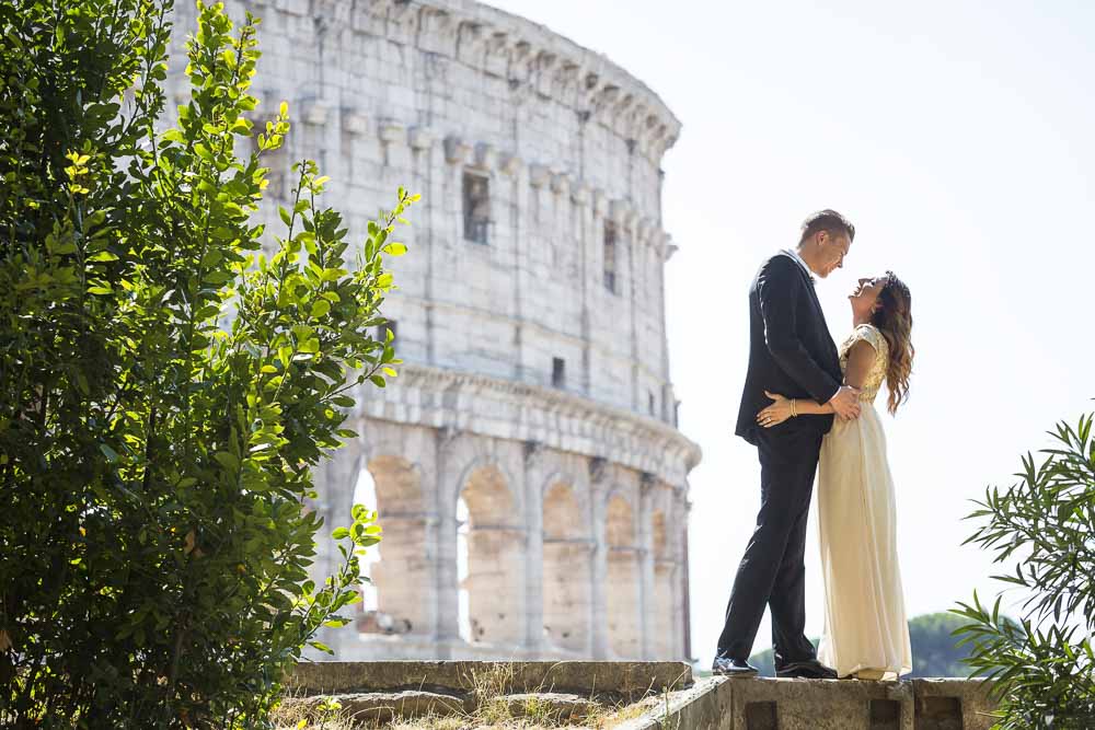 Wedding newlywed couple at the Roman Colosseum on a Rome destination photo shoot