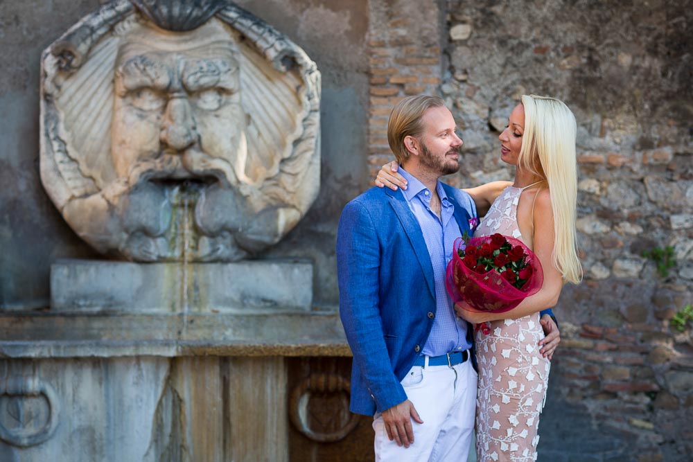 Couple portrait at a marble fountain in Rome