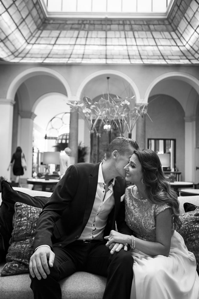 Black and white photo of a couple in a Hotel hall