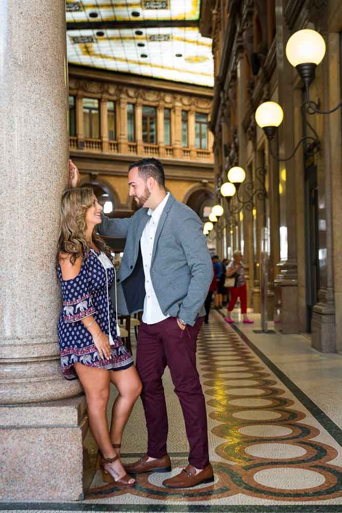 Couple just engaged posing inside the Galleria Alberto Sordi gallery