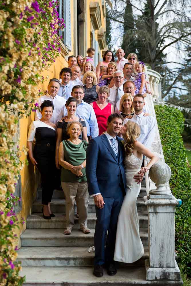 Wedding portrait picture of the guests lined up on the stairs. Pisa Destination Photography 