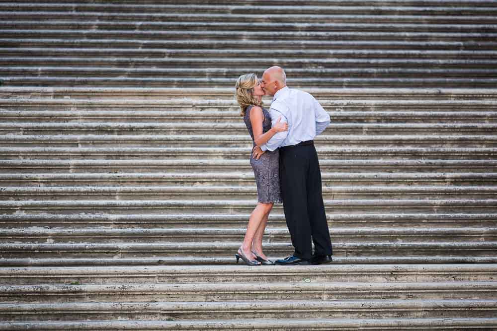 Couple kissing on the campidoglio staircase