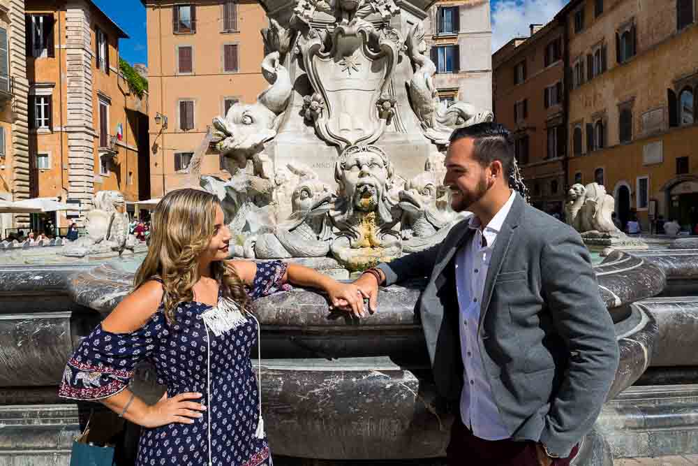 Hand in hand in piazza della rotonda during an engagement photography session