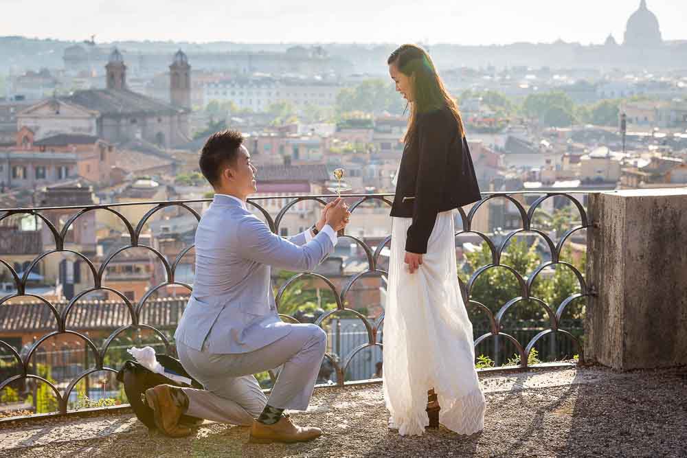 Wedding marriage proposal photographed at sunset overlooking the panoramic city of Rome from above