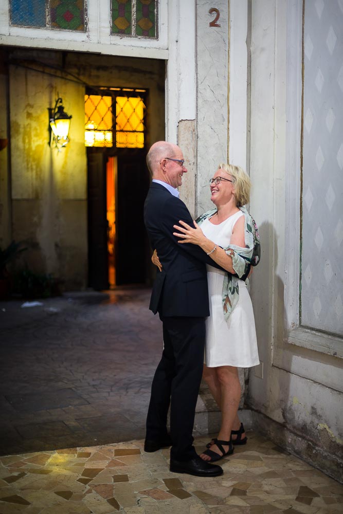 Couple together inside a typical Italian building