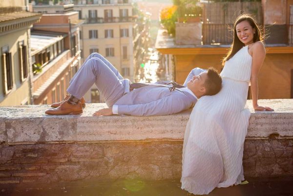 Couple wedding engagement session in Rome Italy overlooking the rooftops at sunset