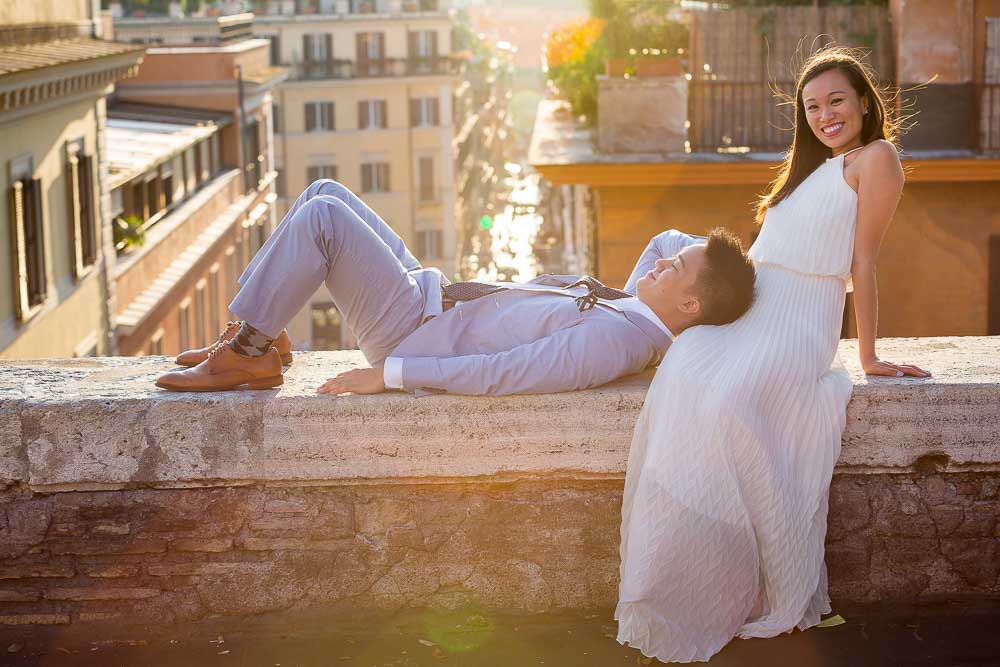 Couple wedding engagement session in Rome Italy overlooking the rooftops at sunset