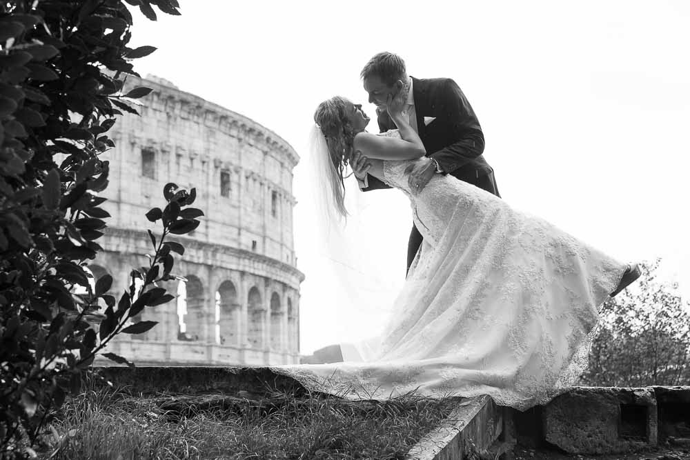 Black and white wedding image at the Colosseum. Rome, Italy.