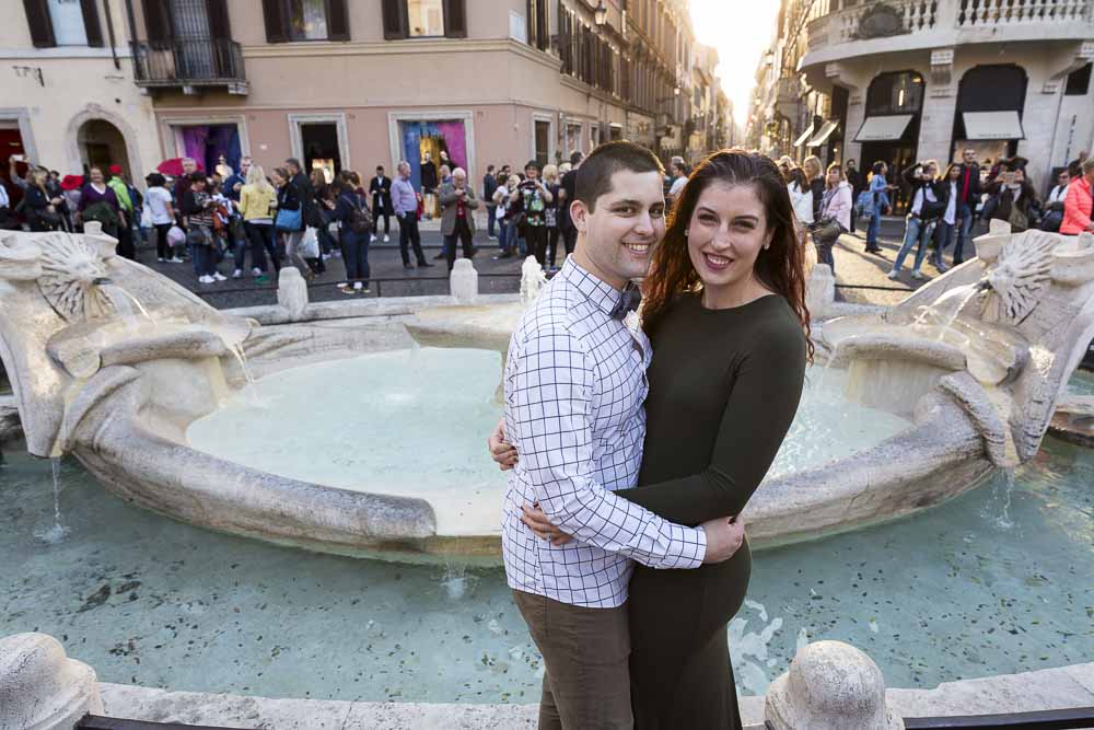 Couple together at the Barcaccia water fountain at the bottom of Piazza di Spagna