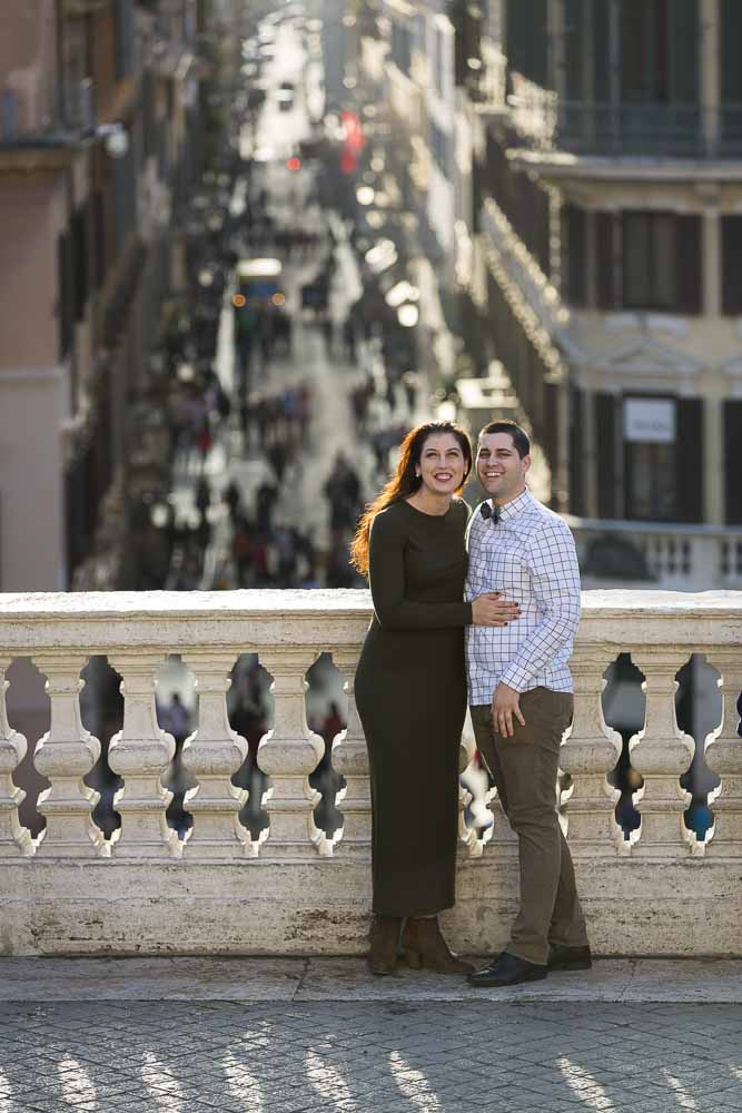 Posing photo of a couple on the terrace overlooking via Condotti