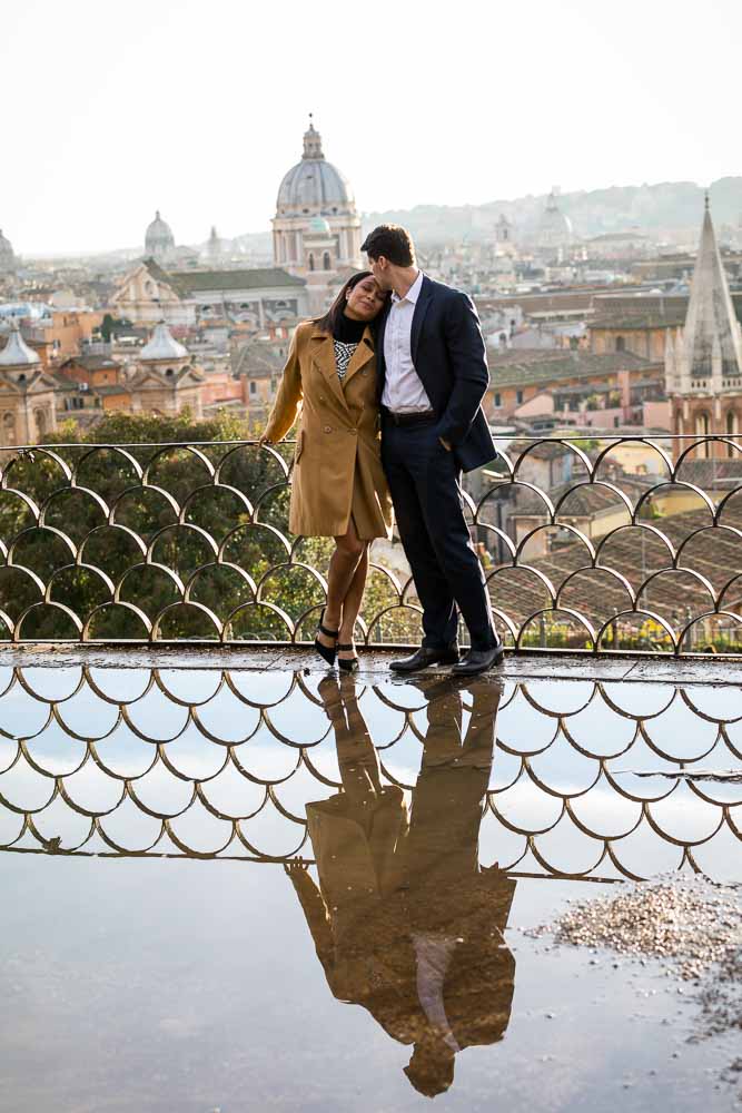 Final image portrait of a couple romantically together in the streets overlooking the city of Roma