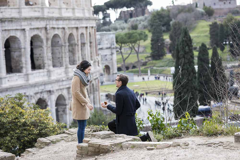 Candid surprise wedding marriage proposal photo shooting at the Roman Colosseum in Rome Italy