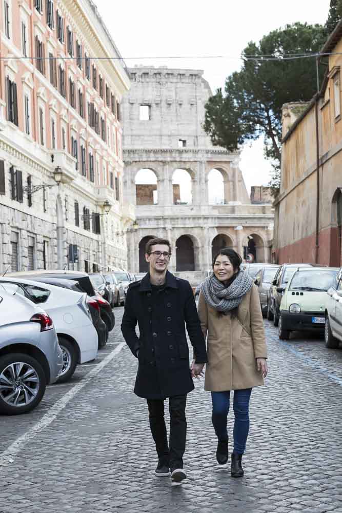 Walking hand in hand in the roman alleyways in an off the beaten track photo session