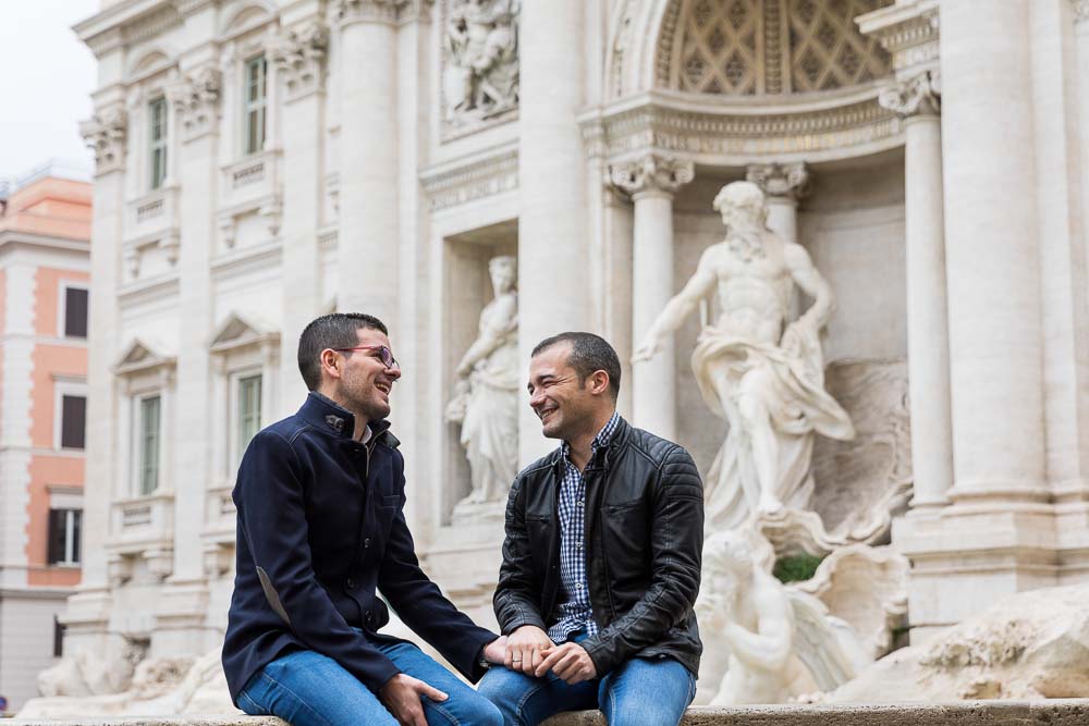 Smiling and laughing together at Fontana di Trevi