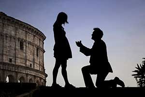 Surprise wedding photography taking place at the Roman Colosseum in Rome Italy