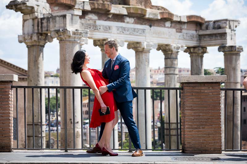 Couple dip at the forum with an ancient temple in the background