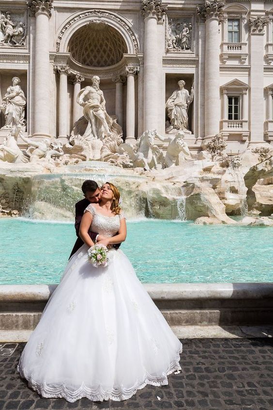 Trevi fountain wedding couple portrait in the sun