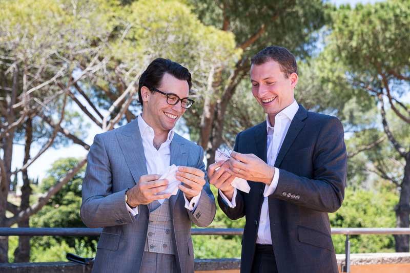 The groom together with the best man getting ready on the terrace