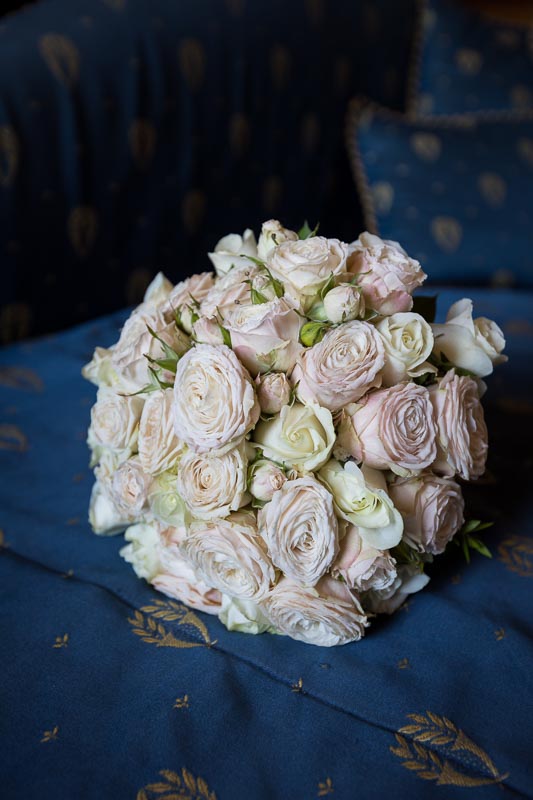 Wedding bouquet photographed against blue background