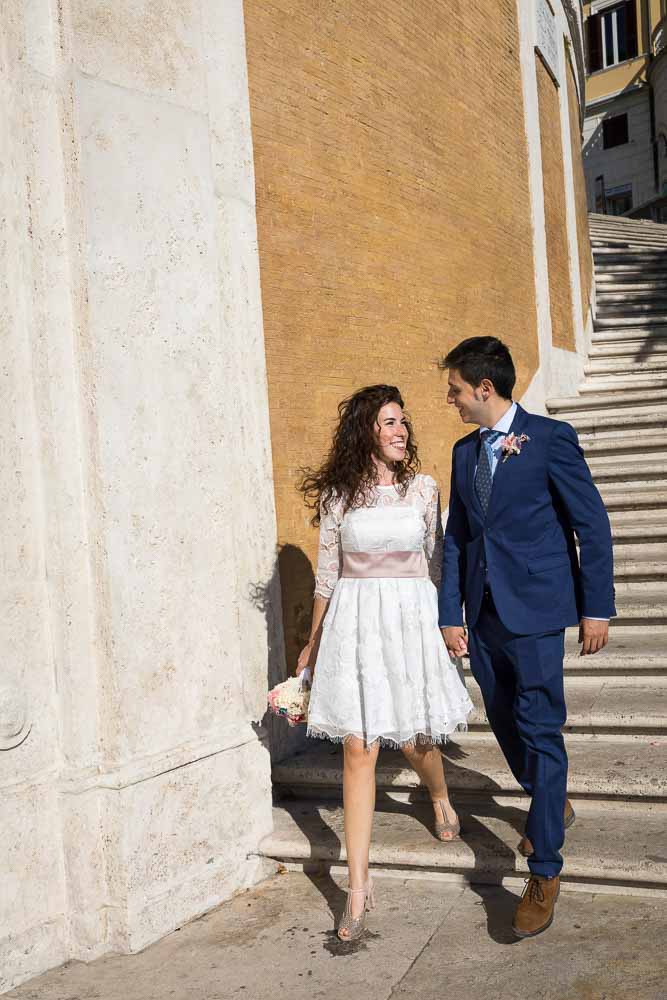 Newlywed descending stairs together